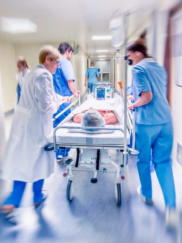 Emergency department people carry patient to hospital