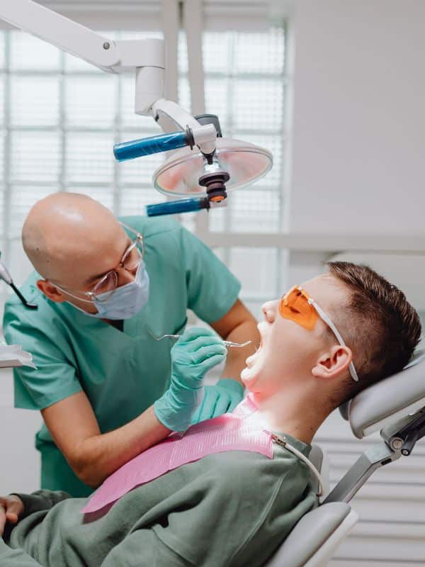 doctor doing Oral Surgery with patient