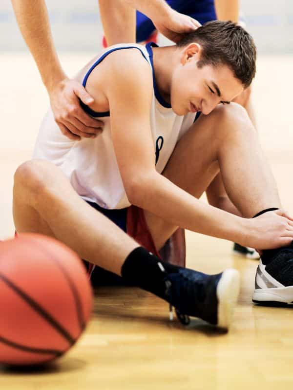 Boy siting with leg pain