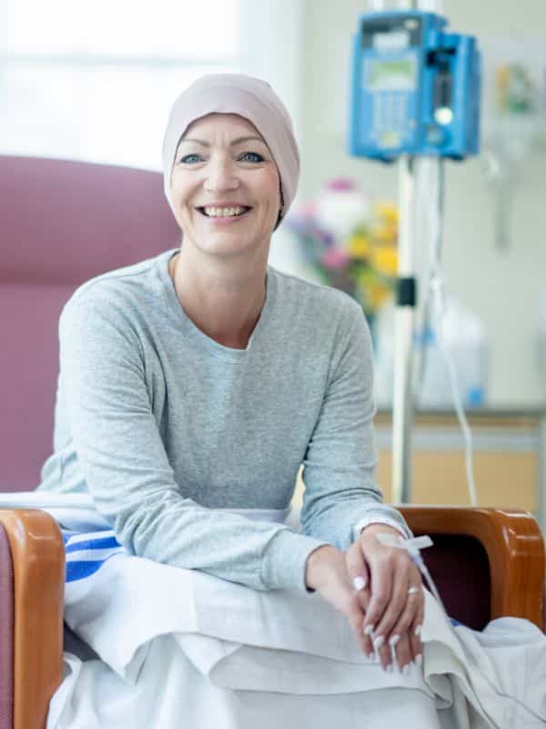 Radiation patient sitting with simile