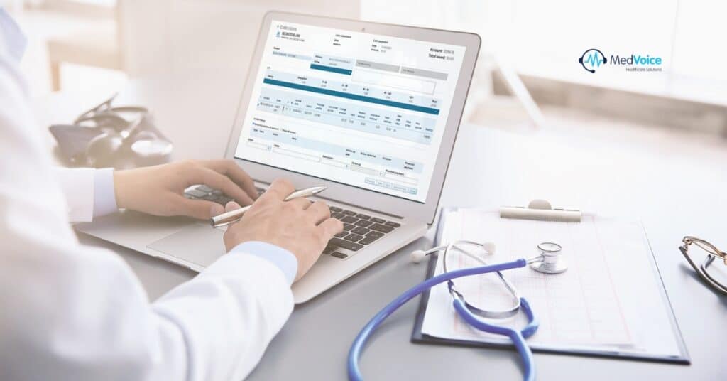 Healthcare professional reviewing billing and coding documents on a computer.