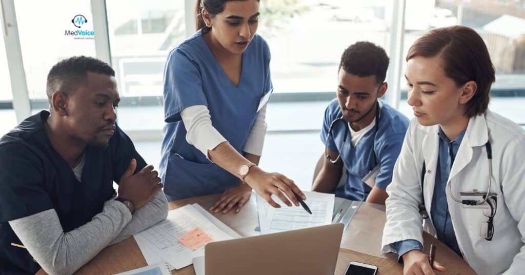 Medical billing specialists analyzing healthcare revenue reports.