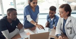 Medical billing specialists analyzing healthcare revenue reports.