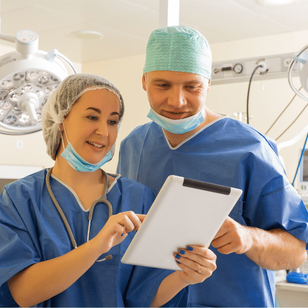 Medical billing staff reviewing denied claims and paperwork
