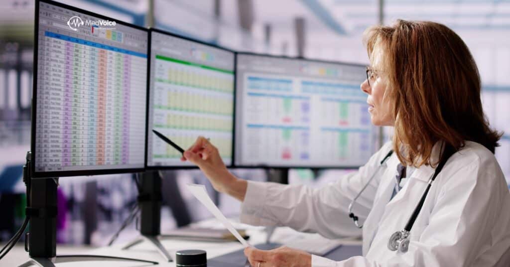 Medical coder reviewing healthcare records on computer for billing accuracy