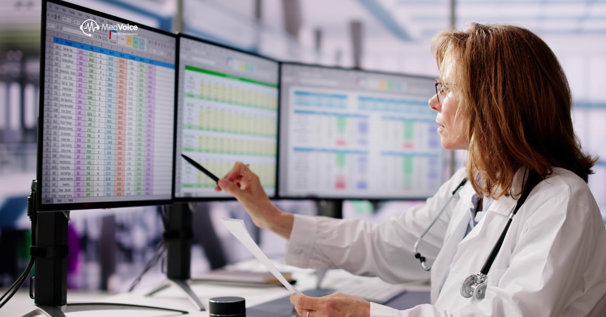 Medical coder reviewing healthcare records on computer for billing accuracy