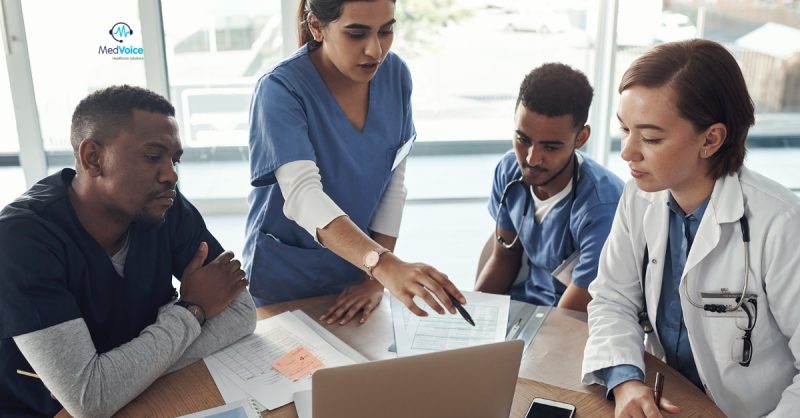 Medical billing specialists analyzing healthcare revenue reports.