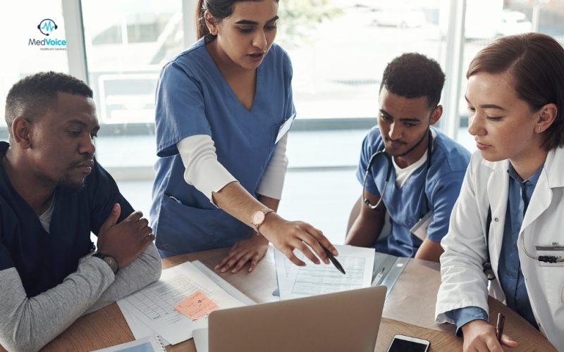 Medical billing specialists analyzing healthcare revenue reports.