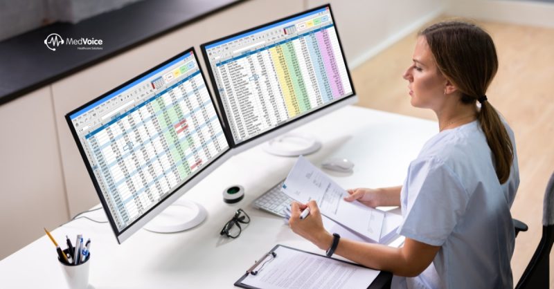 Healthcare team analyzing medical billing data in an office.