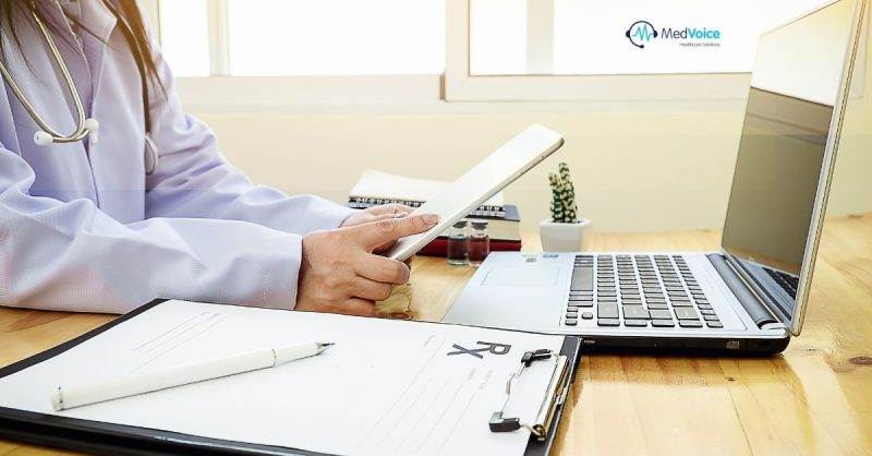 Doctor reviewing denied insurance claims at desk