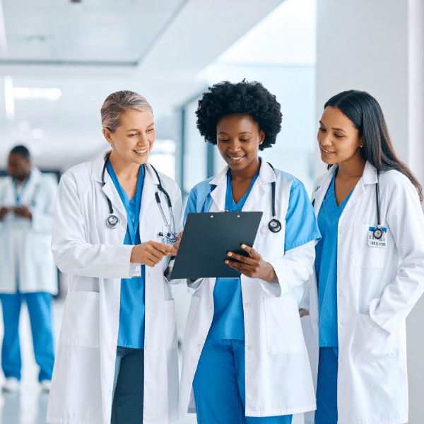 Confident medical team standing together in a small clinic.