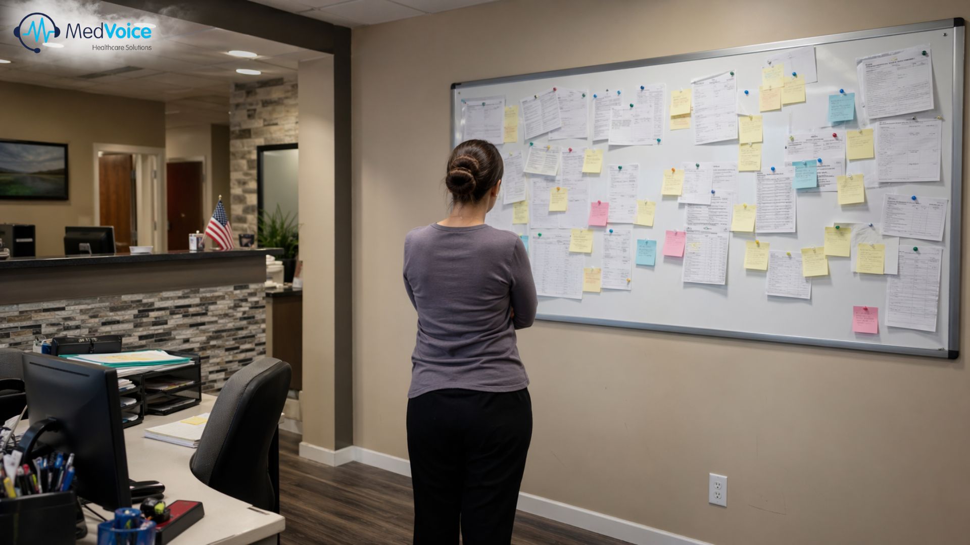 Practice team reviewing billing workflow gaps on an office board