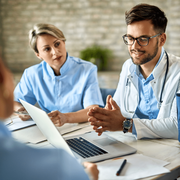 Medical team reviewing billing data and discussing best practices.