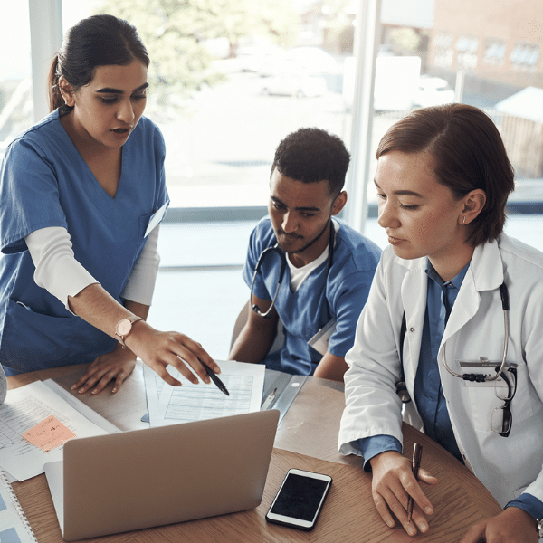 Physician reviewing a financial or billing report on a tablet device.