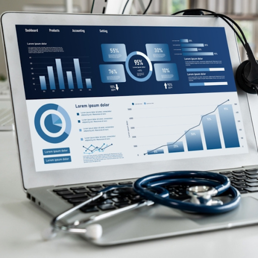 A laptop displays data analytics dashboards with vibrant charts and graphs; a stethoscope rests on the keyboard, highlighting how independent practices can streamline operations through outsourcing medical billing.